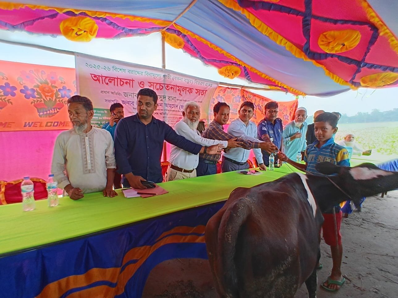 Cow distribution handover to a girl beneficiary.